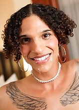 Watch Deja Beige as she shows off her sexy tattooed body, spreads her nice ass and strokes her long cock until she cums in her own mouth